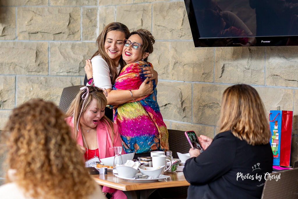 Enjoying the meeting, Judith and Pauline hug